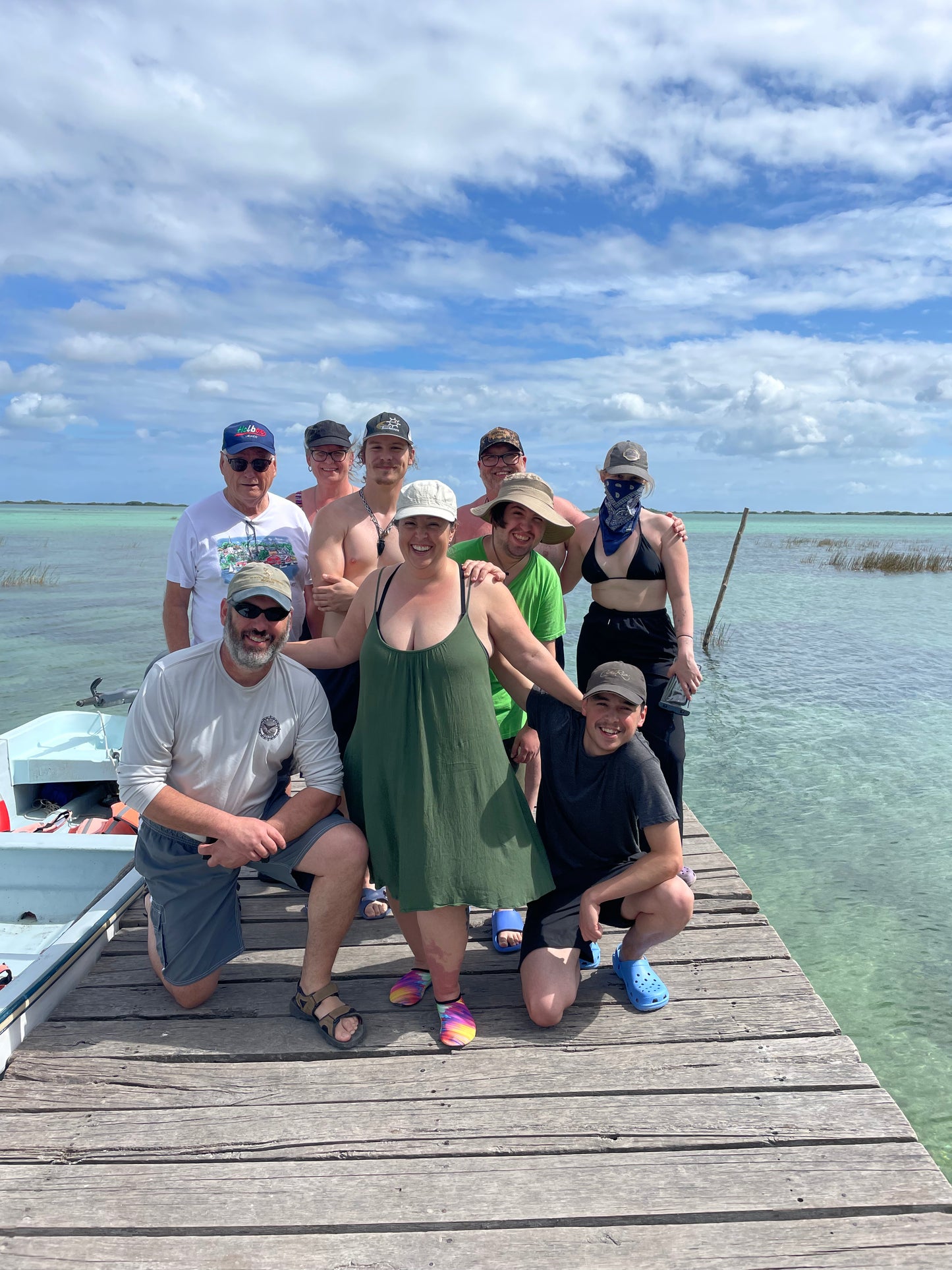 Small group of travelers on a dock at Bacalar Lagoon, Crossing Yucatán journey