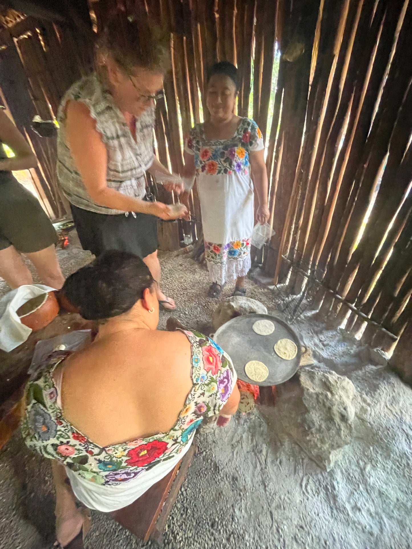 Handmade tortillas on the comal in a Maya kitchen, Aldea Xbatún, Yucatán
