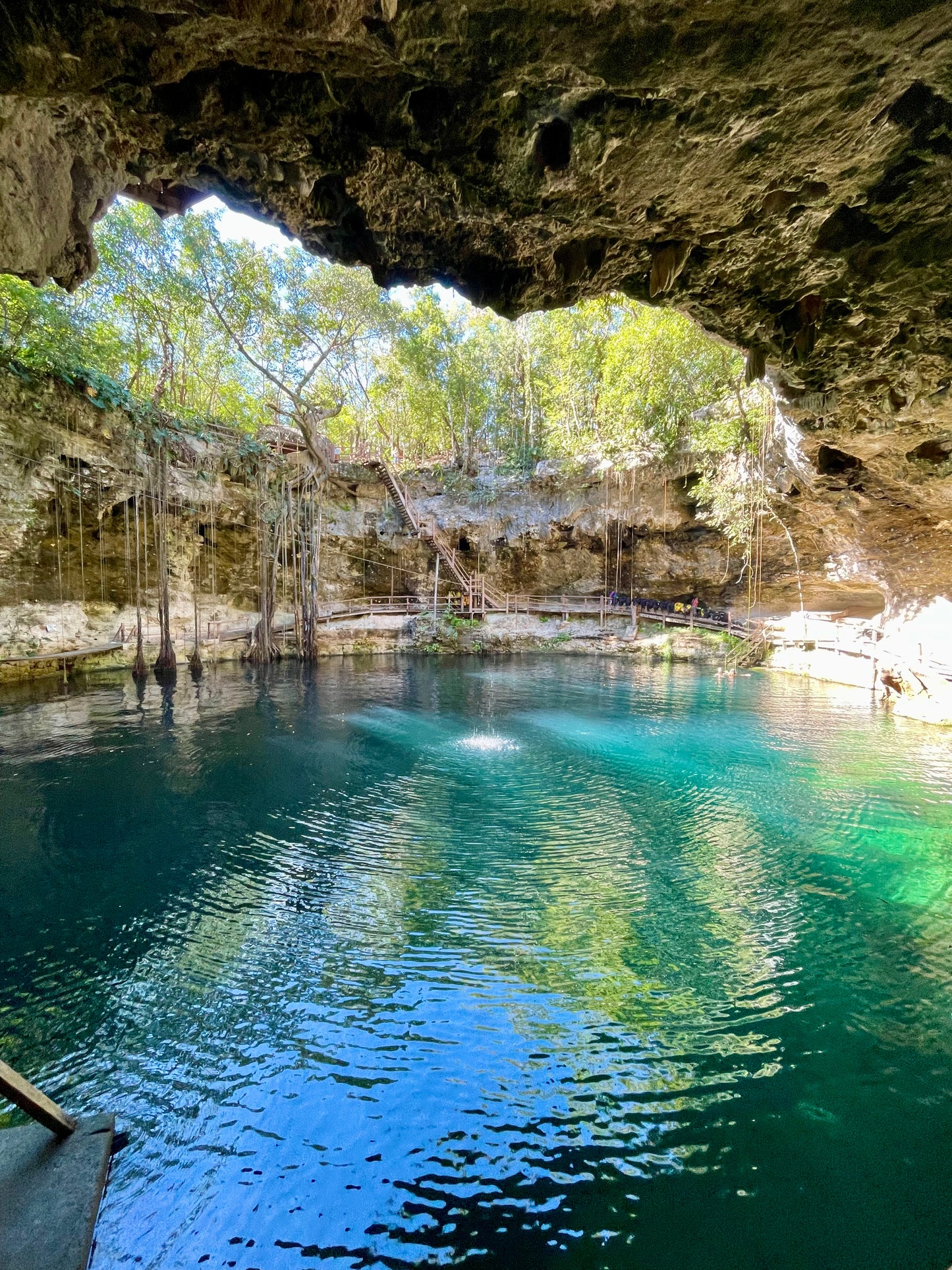 Cenote X'Canché near Ek Balam, turquoise water under the jungle, Crossing Yucatán journey